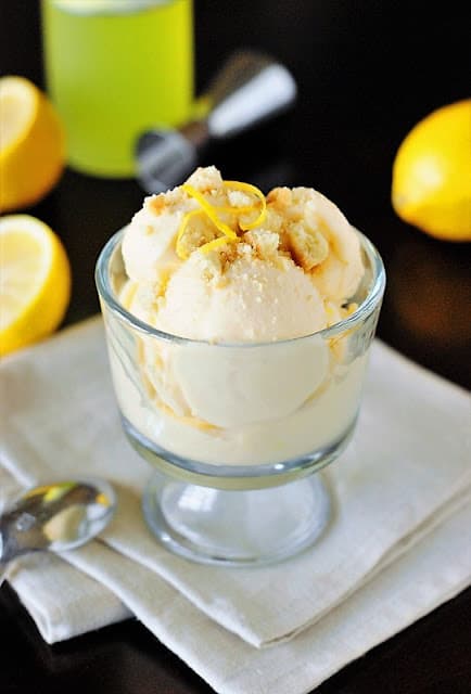 Limoncello ice cream in glass container placed on white napkin