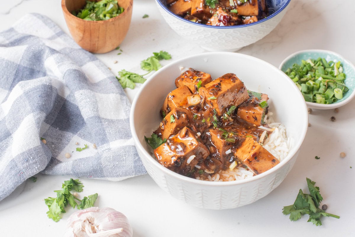 A close up image of mapo tofu served in a bowl.