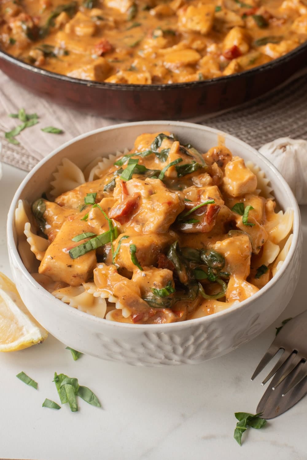 Bowl of creamy Marry Me Tofu served over pasta.