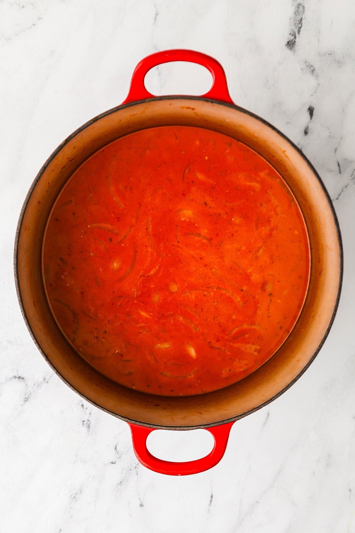 An overhead image of adding the rest of the coconut milk.
