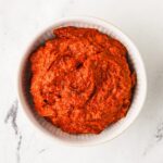 Overhead shot of homemade massaman curry paste in a bowl.