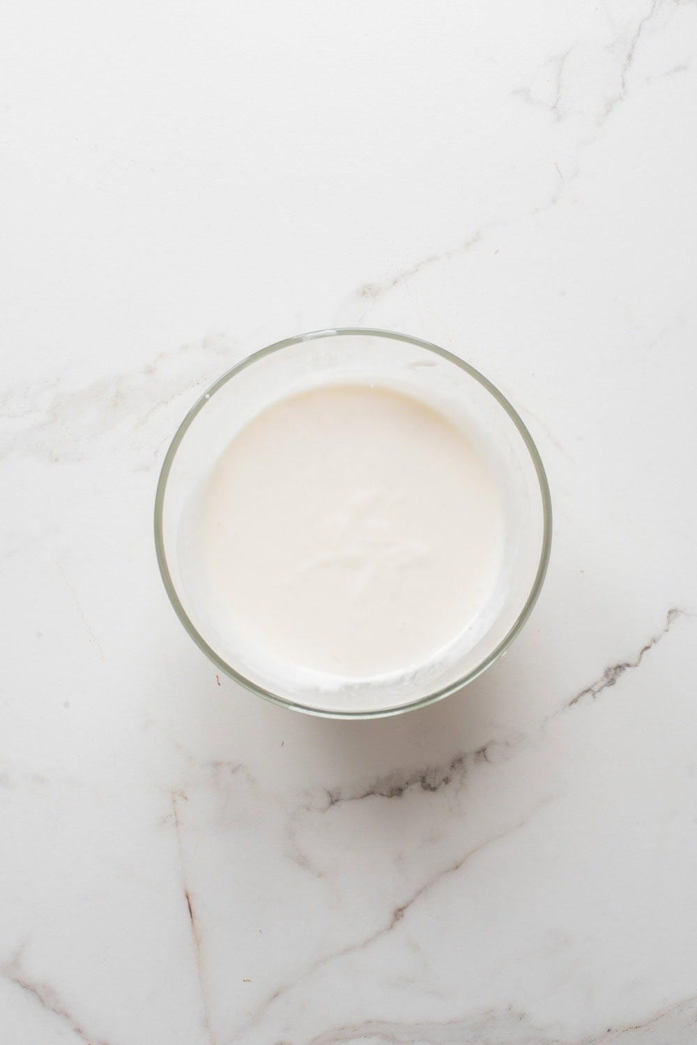 An overhead image of whisking the crema together.