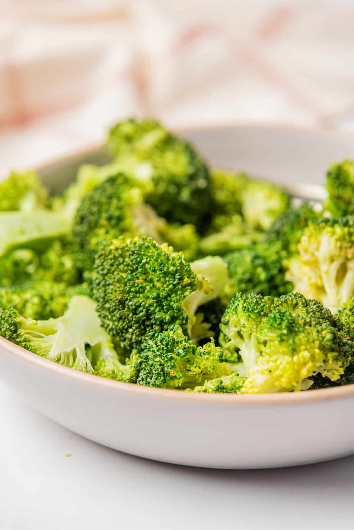 a close up image of microwave broccoli on a dish