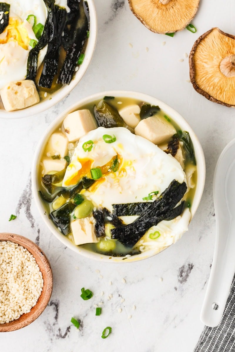 An overhead image of miso soup with tofu served in a bowl.
