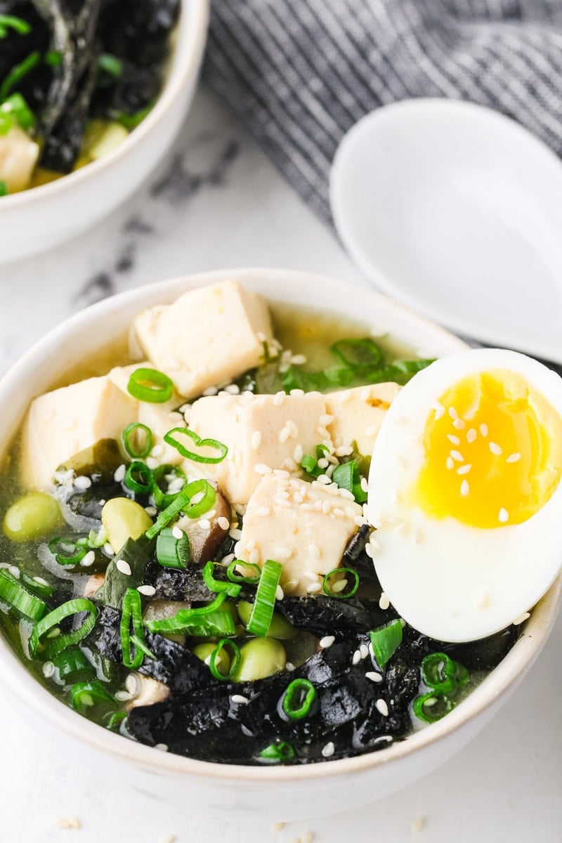 An overhead image of miso soup with tofu served in a bowl.