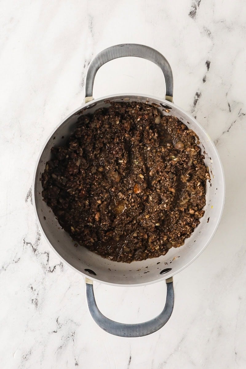 Finely chopped mushrooms cooked down in a saucepan until dry and browned