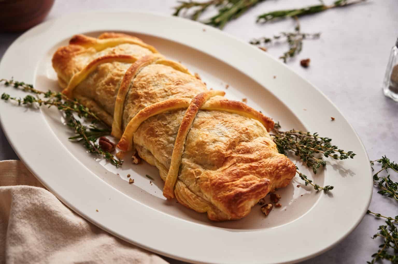 An overhead image of mushroom wellington in a serving plate.