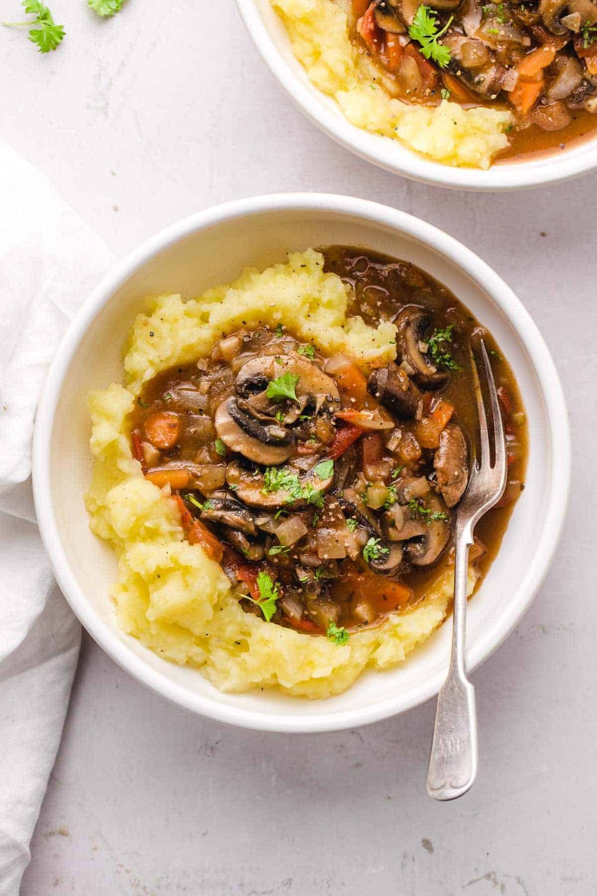 Overhead view of Mushroom Stew Recipe - Nourish Plate with mashed potatoes.