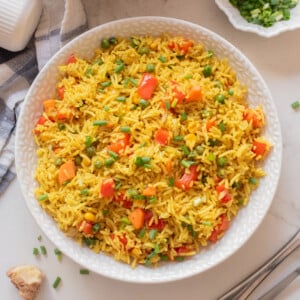 Overhead image of Nigerian fried rice on a white plate.