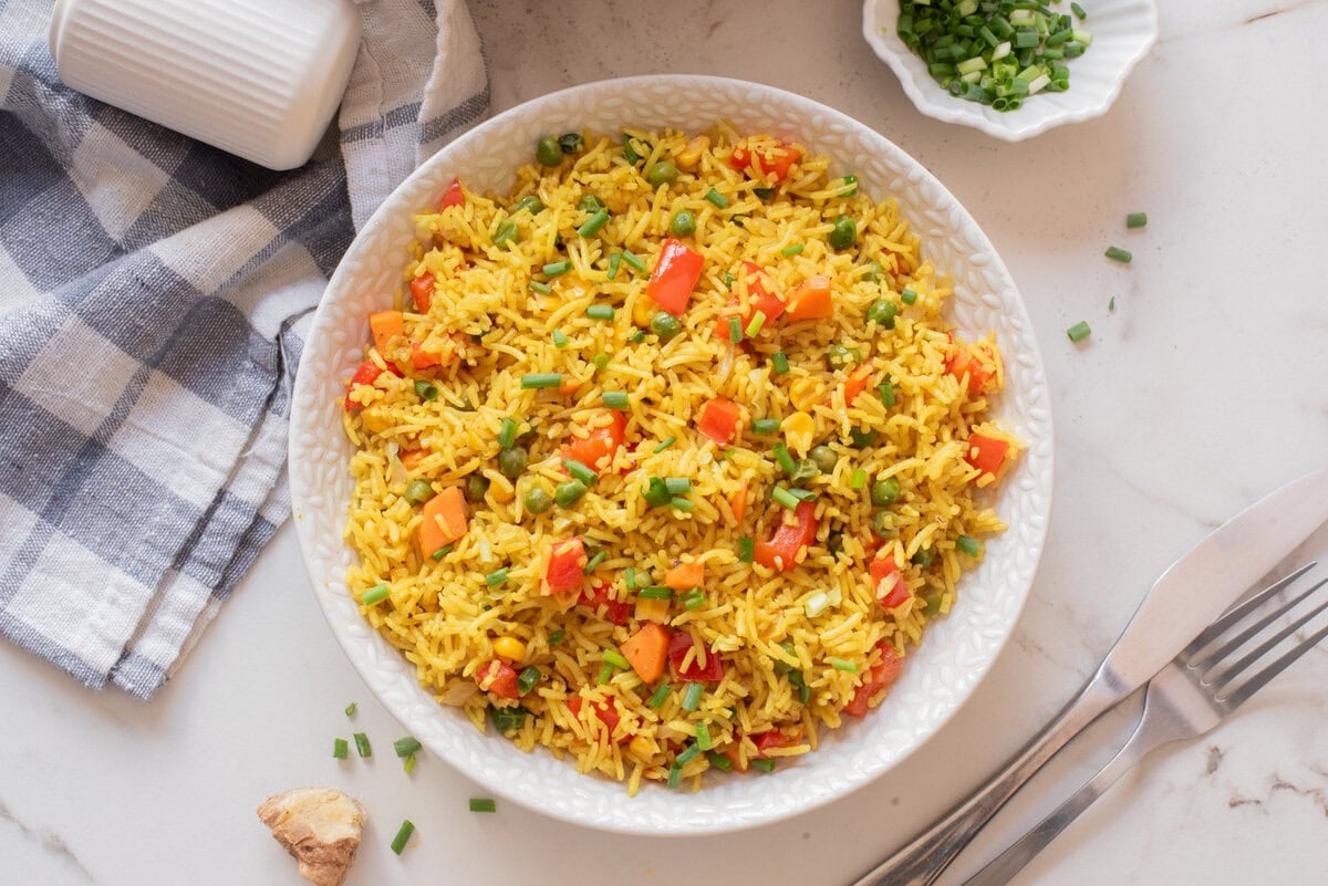 Overhead image of Nigerian fried rice on a white plate.