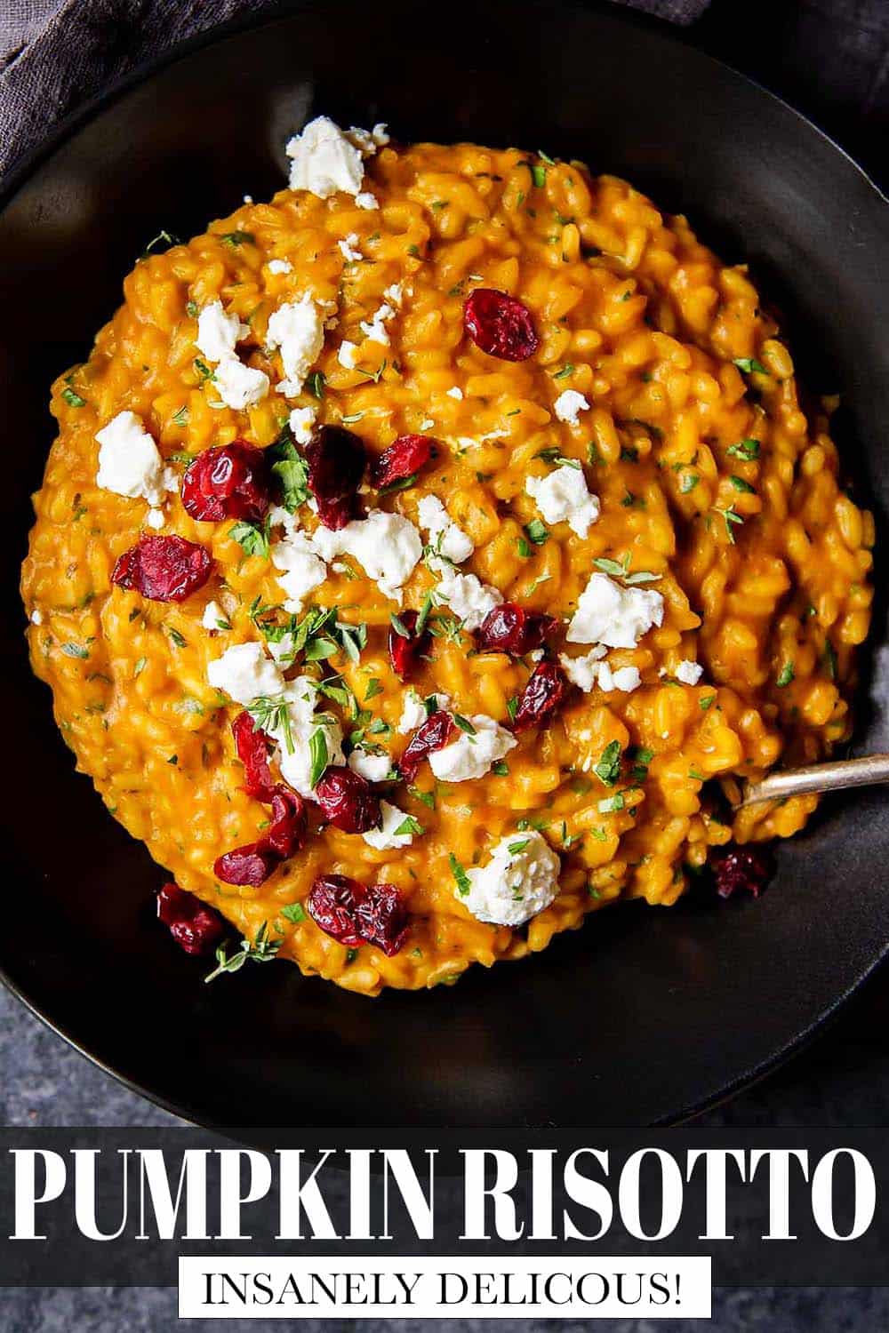 Overhead shot of Pumpkin Risotto with Goat Cheese and Cranberries on top.