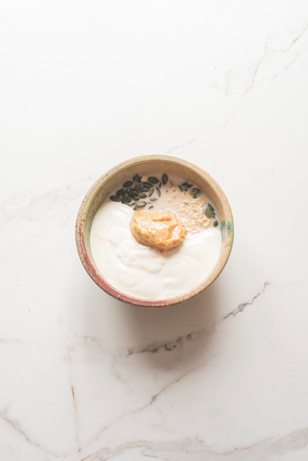 An overhead image of combining the ingredients together in a bowl.