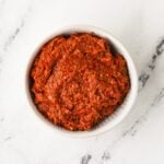 Overhead image of vegan Thai red curry paste in a bowl.