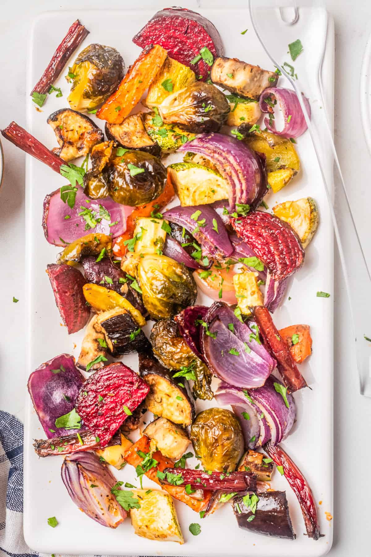 An overhead image of roasted vegetable salad on a serving dish.
