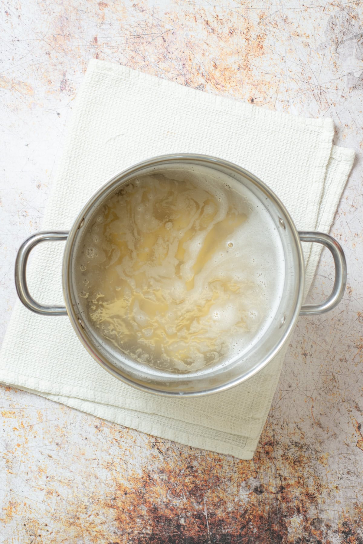Rigatoni boiling in a pot of salted water.