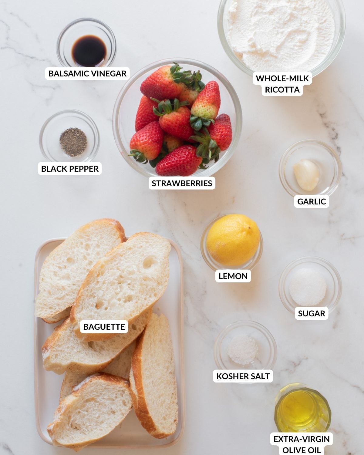 Overhead image of the ingredients for strawberry basil whipped ricotta bruschetta.