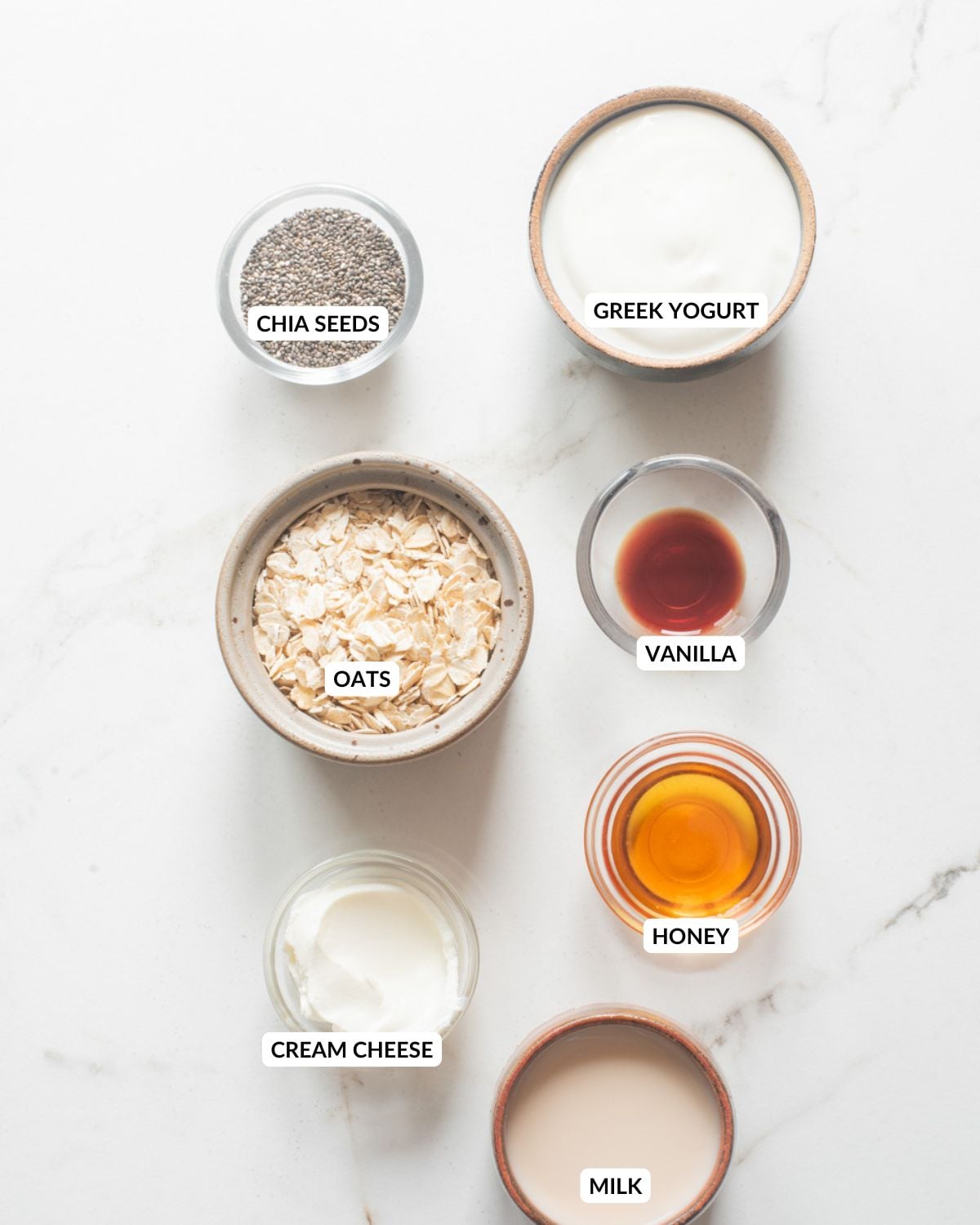 Overhead view of ingredients for strawberry cheesecake oats