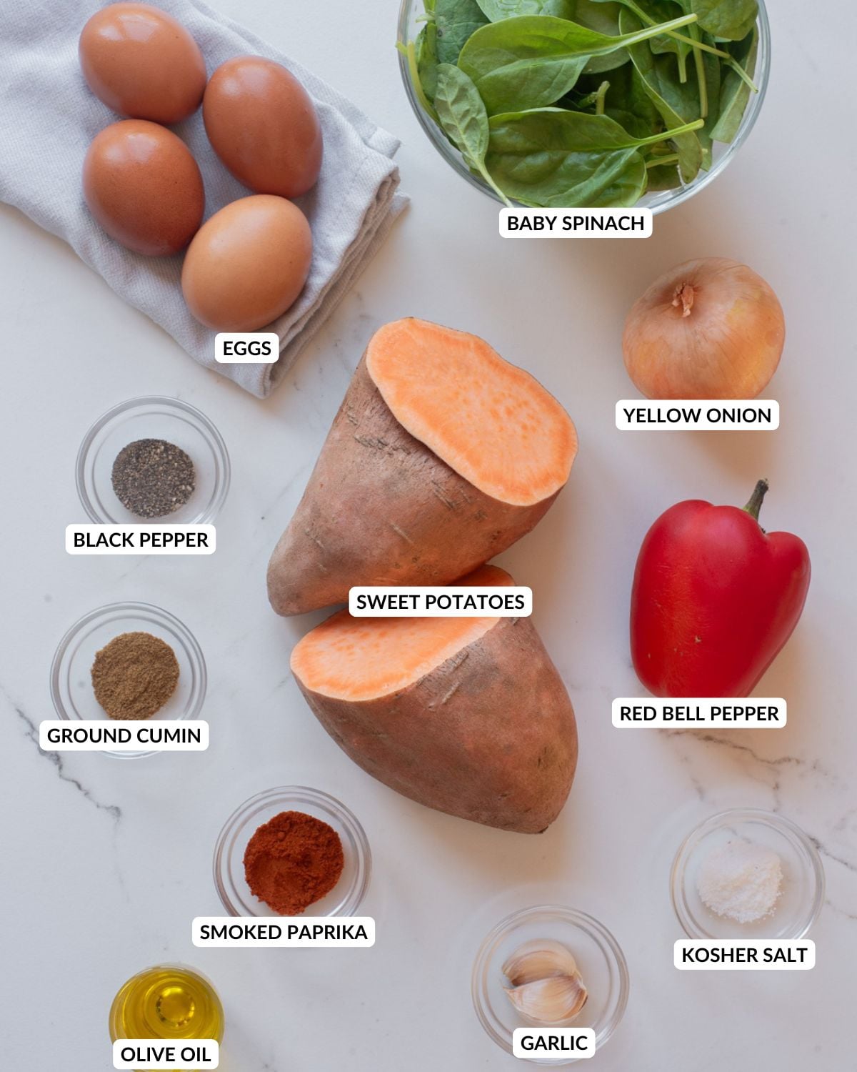 Ingredients for sweet potato breakfast hash arranged in a marble surface.