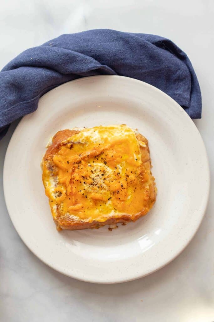 Savory French toast with egg-in-hole and lots of cheddar cheese 
