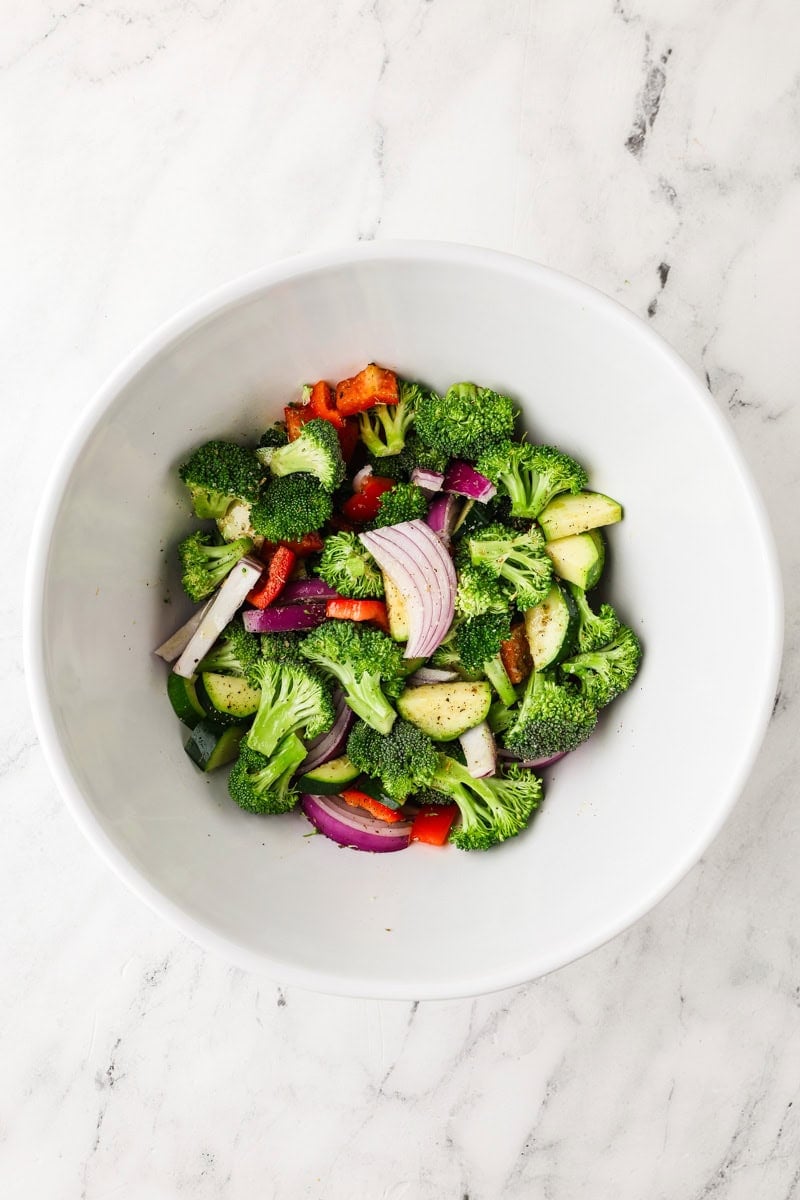 An overhead image of adding the chopped veggies in a separate bowl.