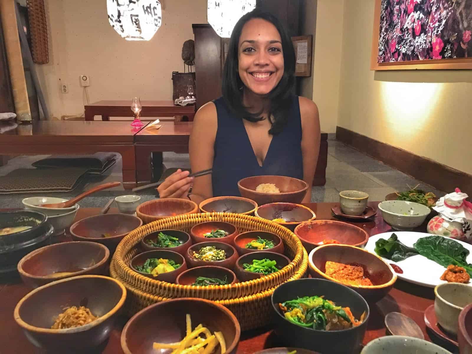 Shruthi with Korean banchan in front of her