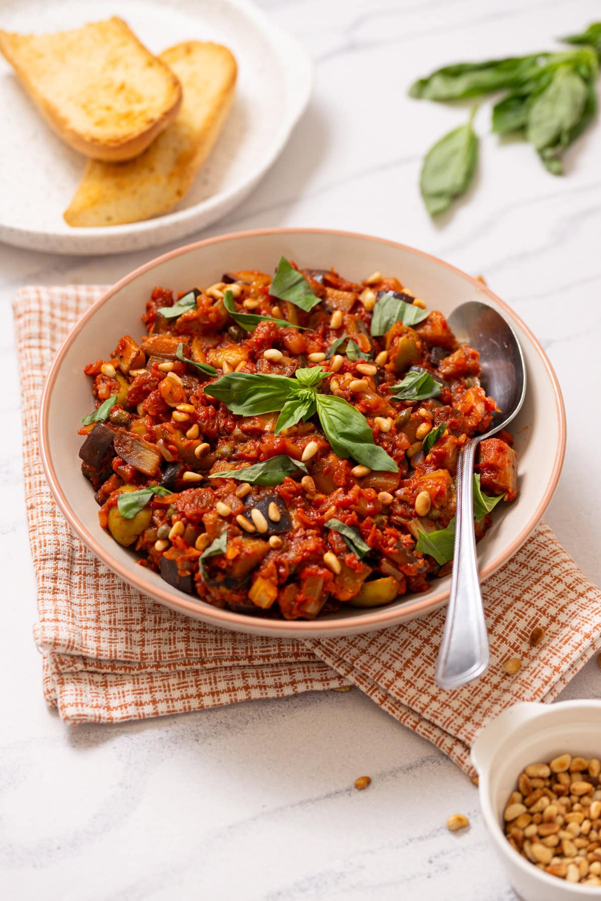 A close up image of Sicilian Caponata served in a bowl.