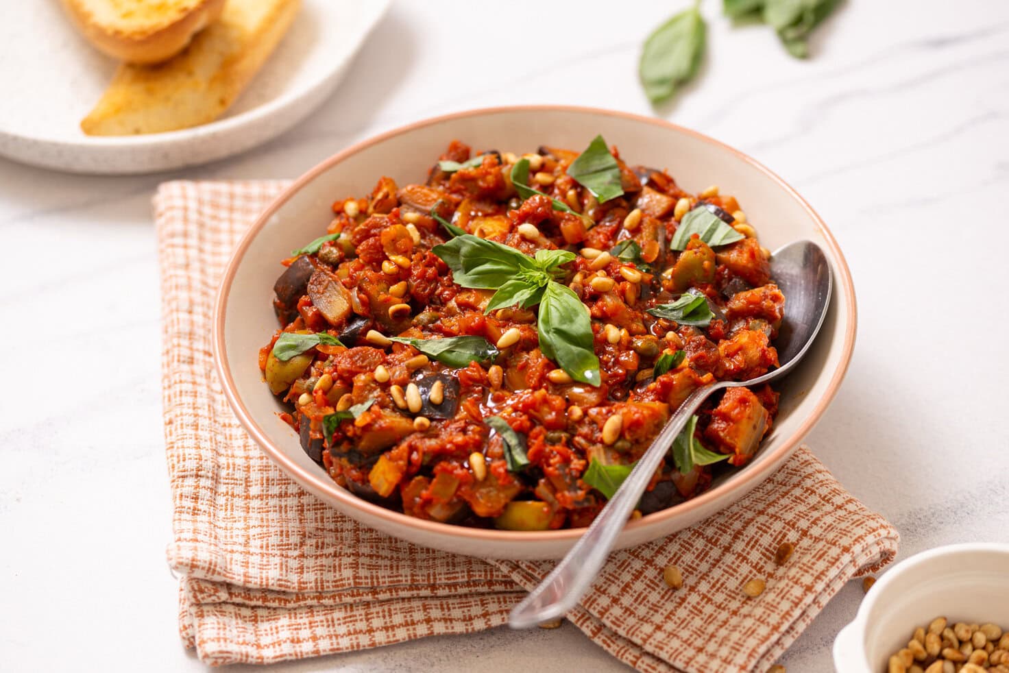 A close up image of Sicilian Caponata served in a bowl.