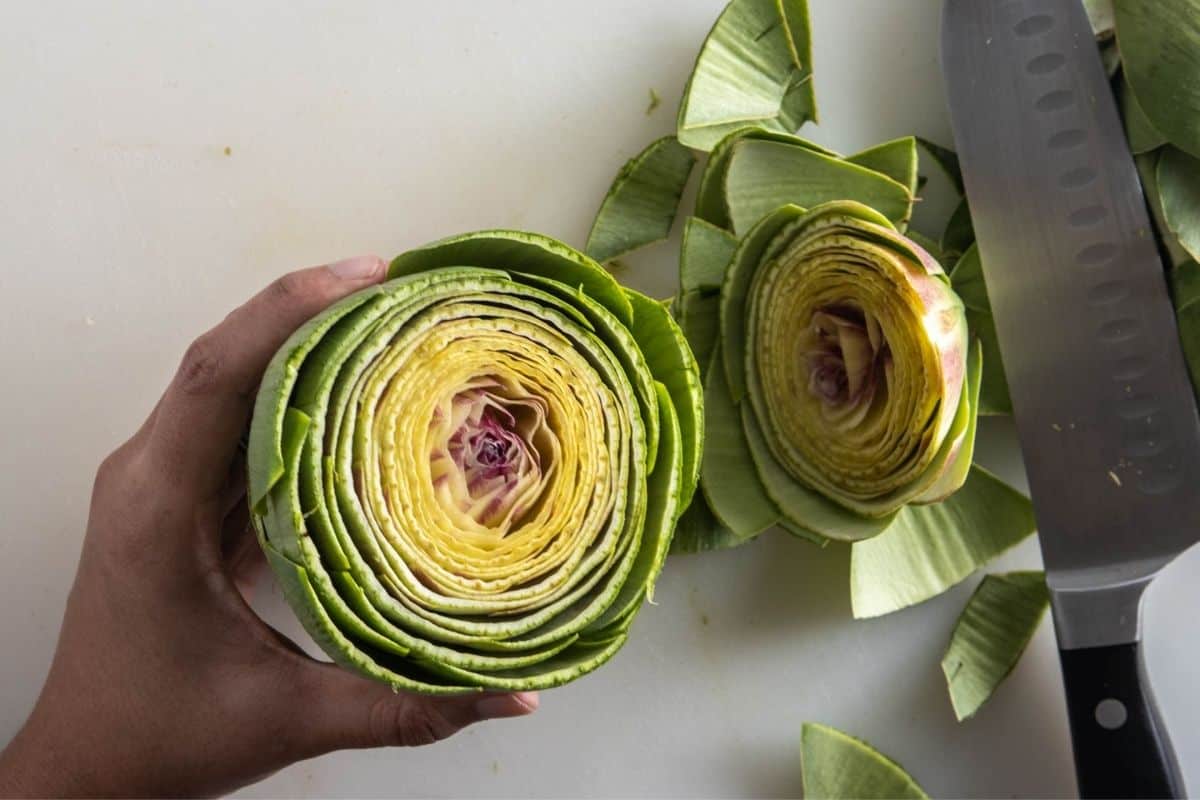 Image showing what the inner part of the artichoke looks like once sliced into two parts