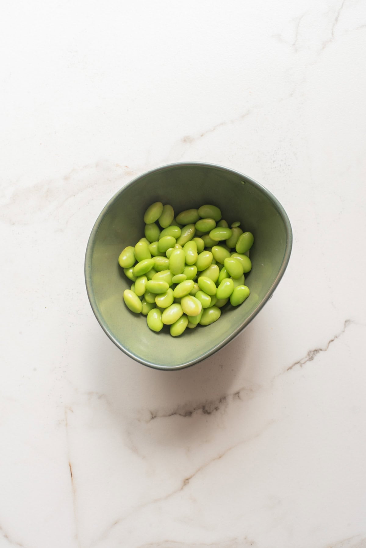 An overhead image of heating the edamame.