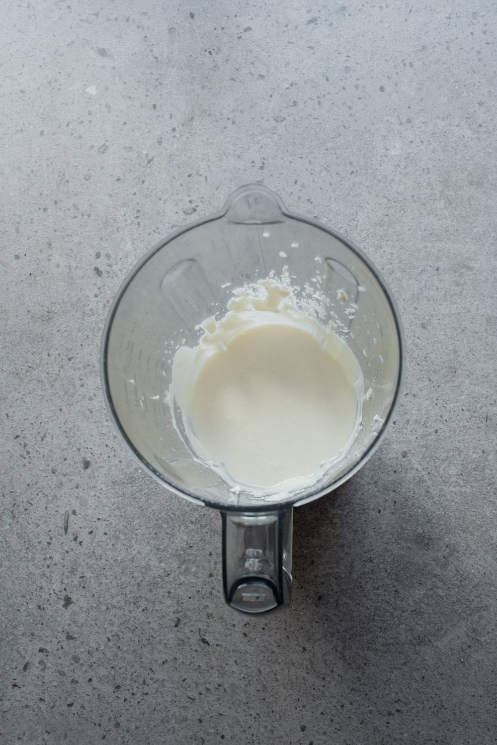 An overhead image of blending the cottage cheese until smooth.