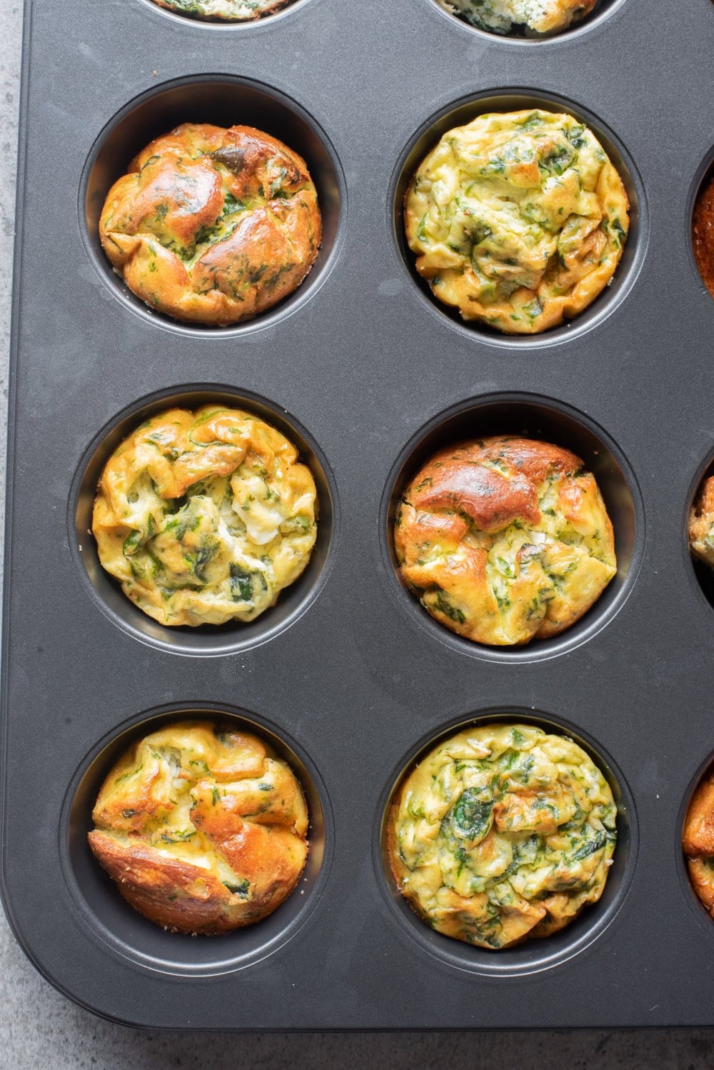 An overhead image of the baked cottage cheese egg muffins in the muffin tins.