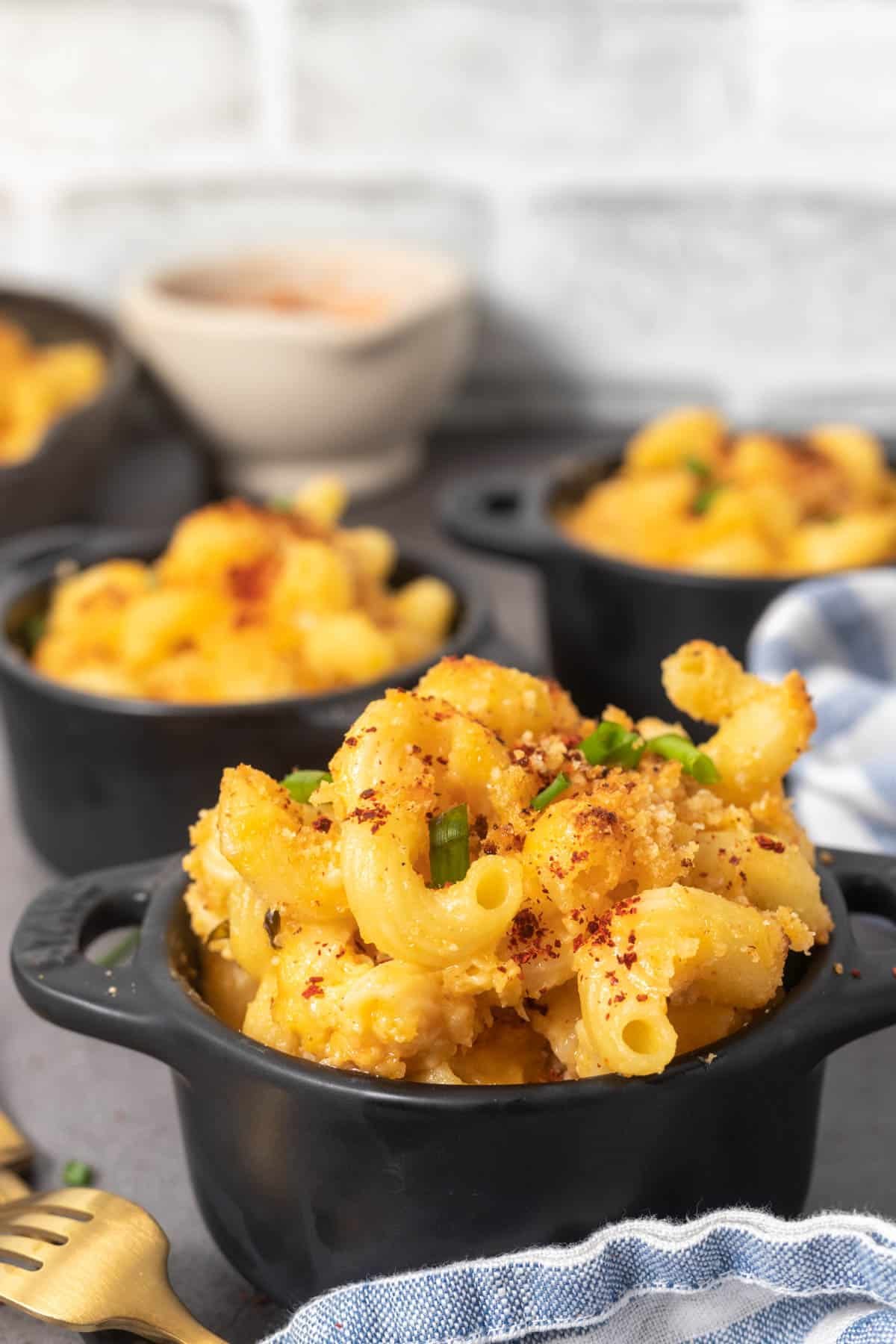 Close up of kimchi mac and cheese in a mini cocotte