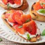 Strawberry basil bruschetta with whipped lemon ricotta on toasted baguette.