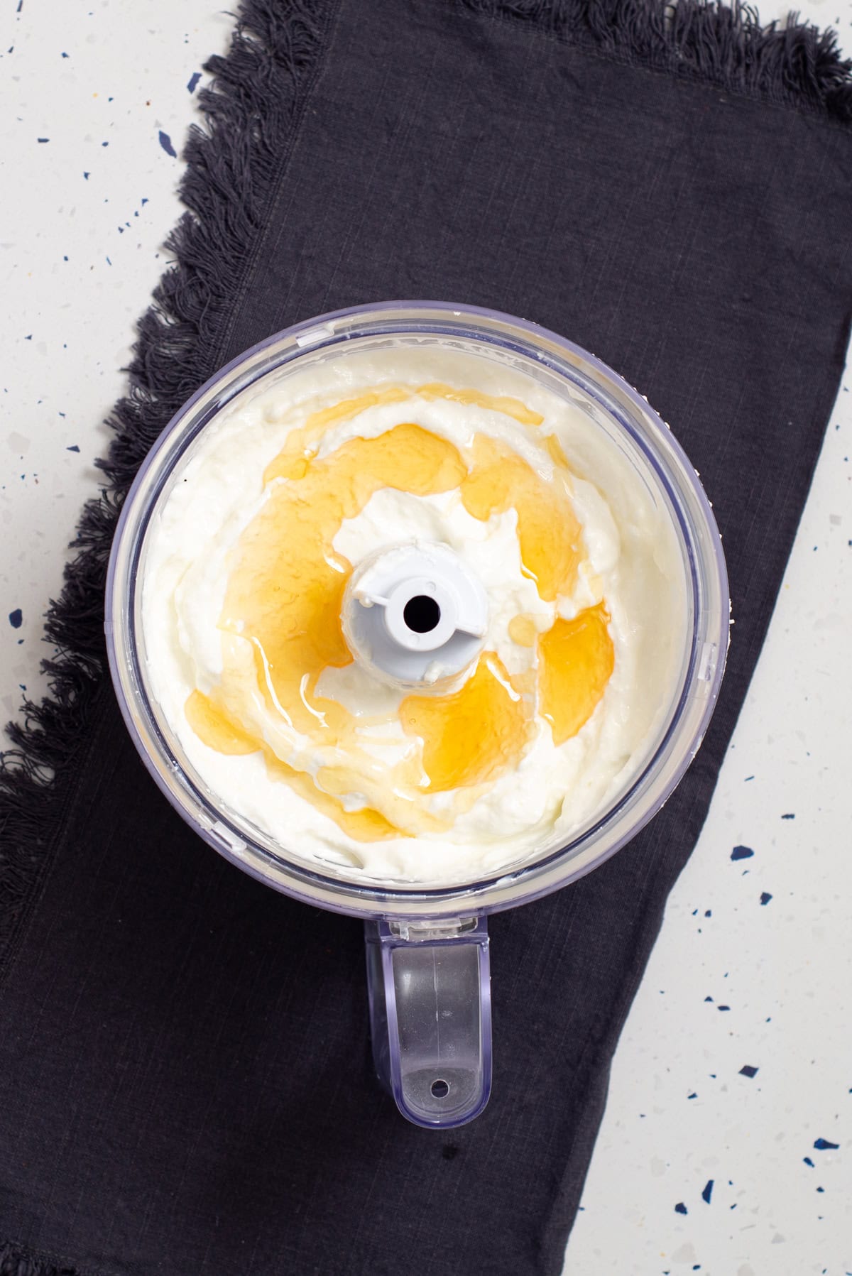 Cottage cheese, Greek yogurt, vanilla, and honey blended together in a food processor.