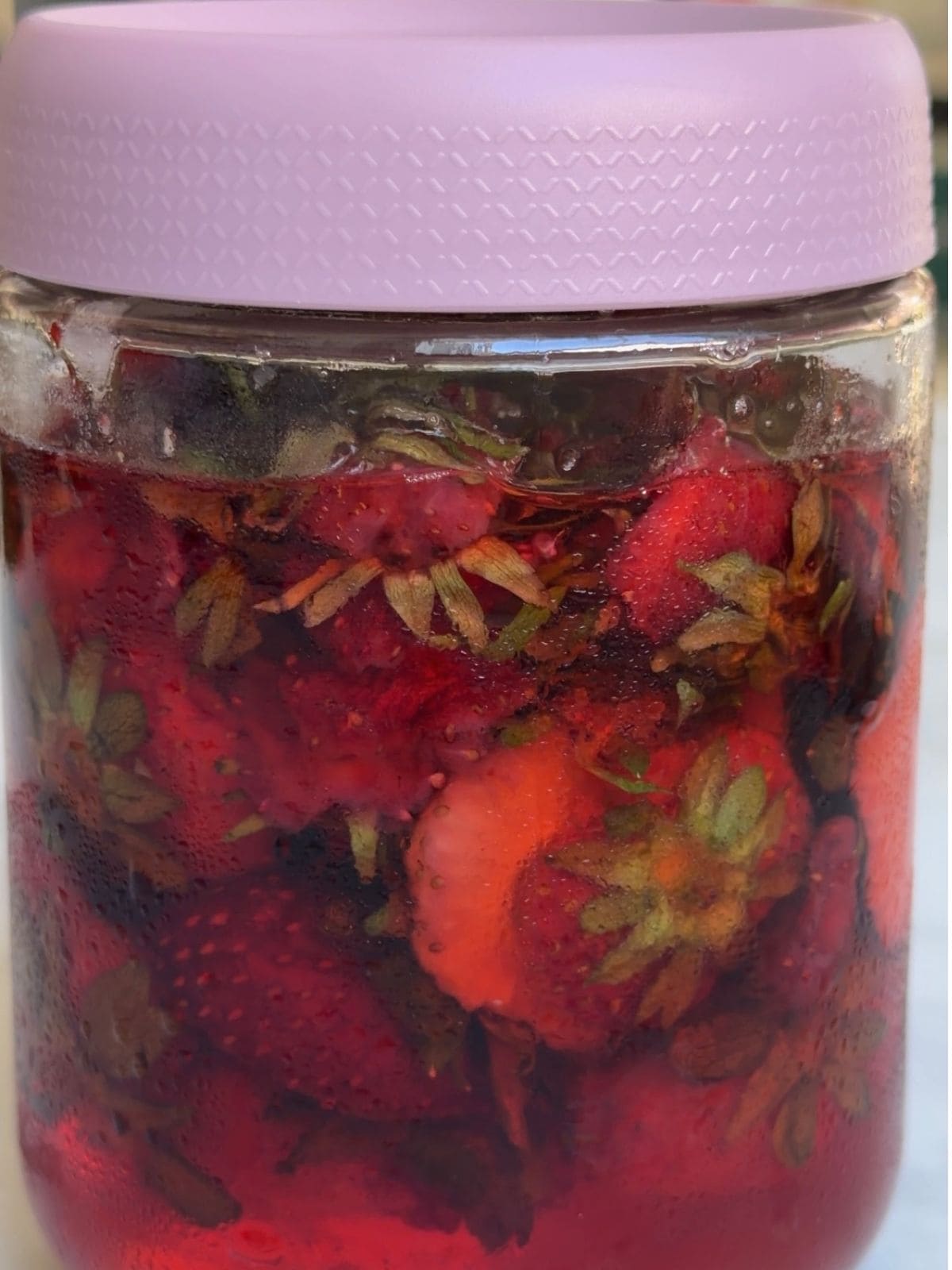 Strawberry tops with sugar after one day in the fridge