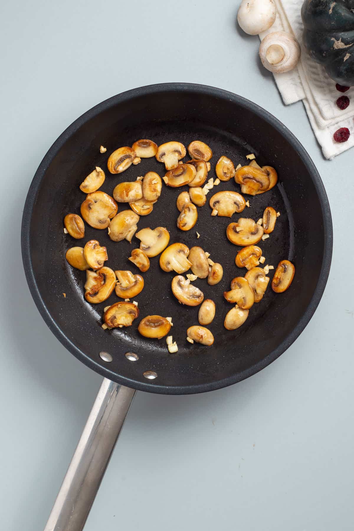Overhead view of skillet with mushrooms.