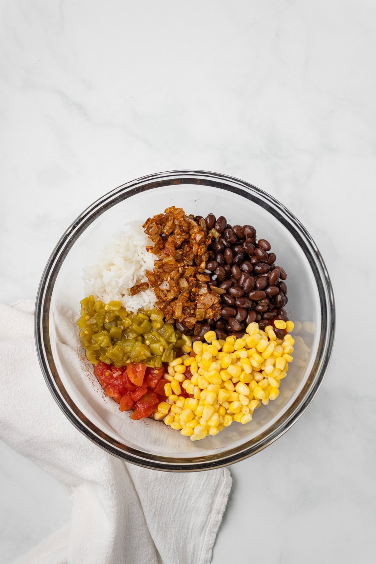 An overhead image of adding the filling ingredients in a bowl.