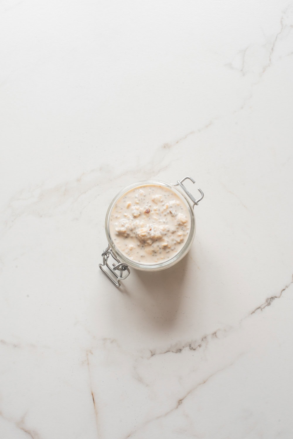 Tahini date overnight oats without toppings in a jar.