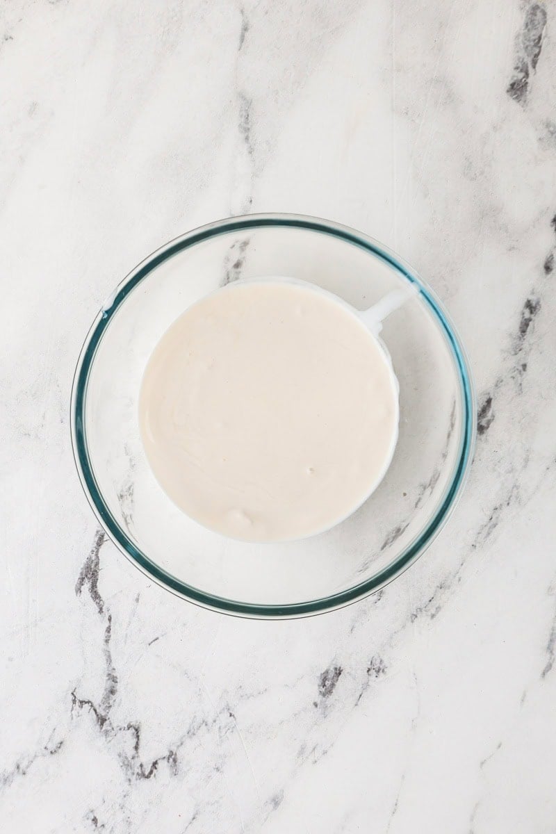 Coconut milk in a glass bowl.