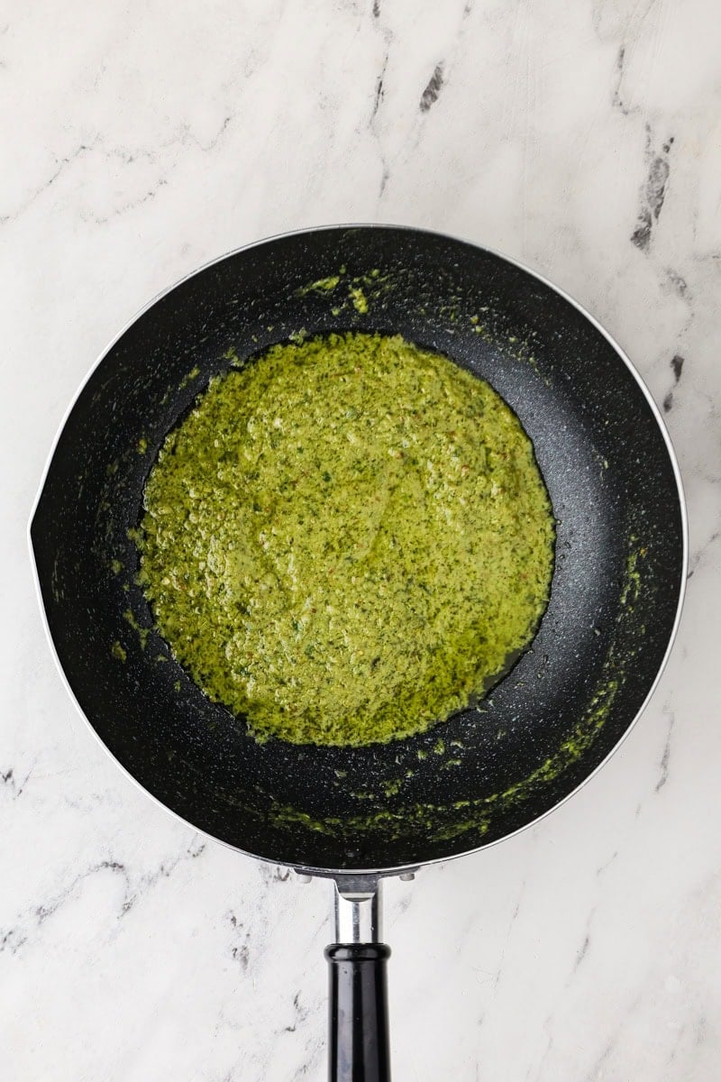 Coconut milk added in the green curry paste for Thai green curry.