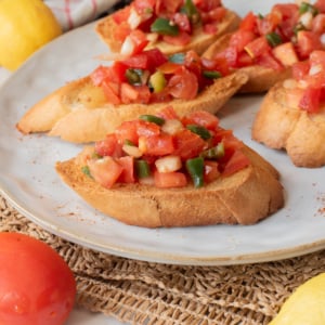 A close up image of timatim served on toasted bread.