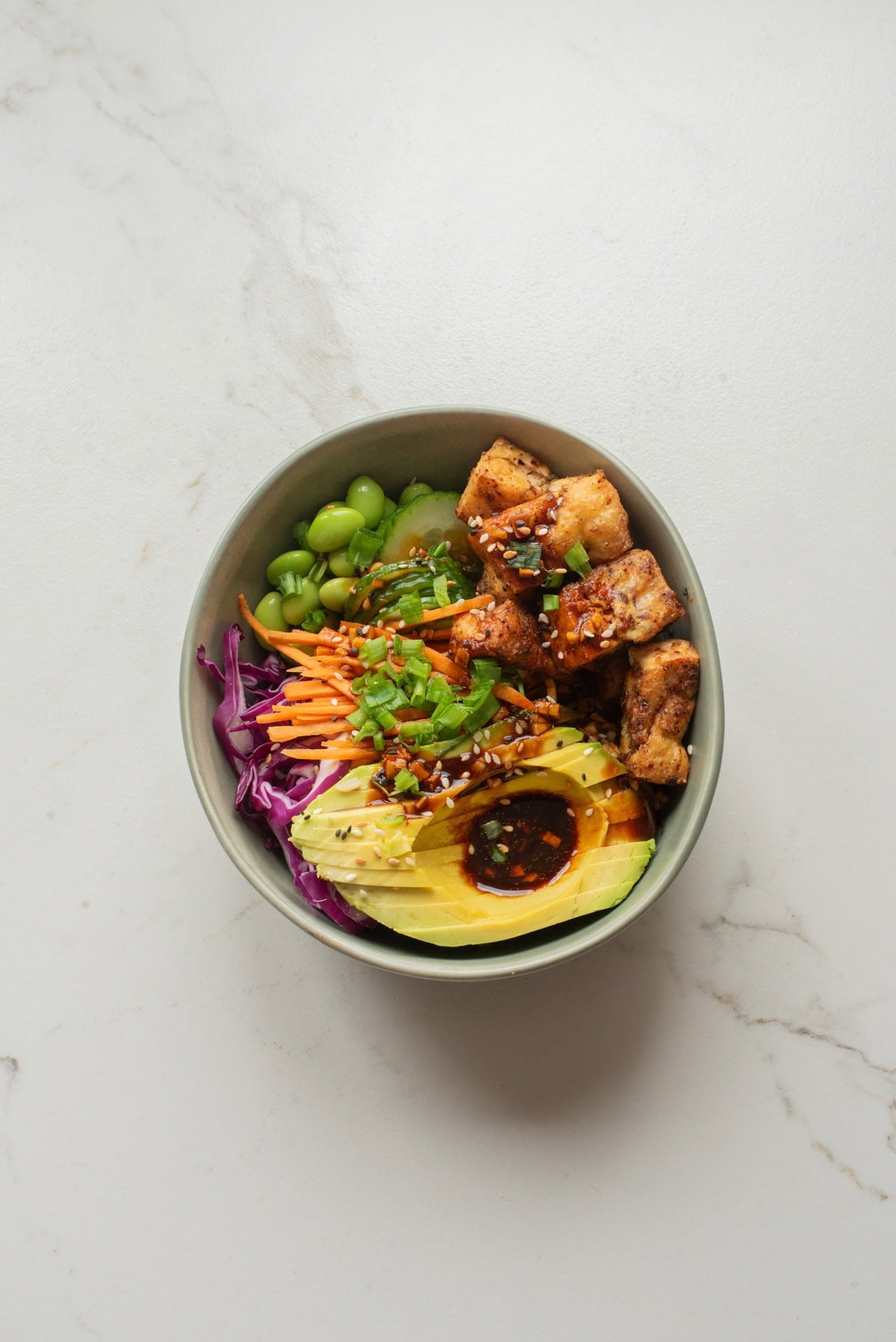 An overhead image of arranging the ingredients in a bowl.