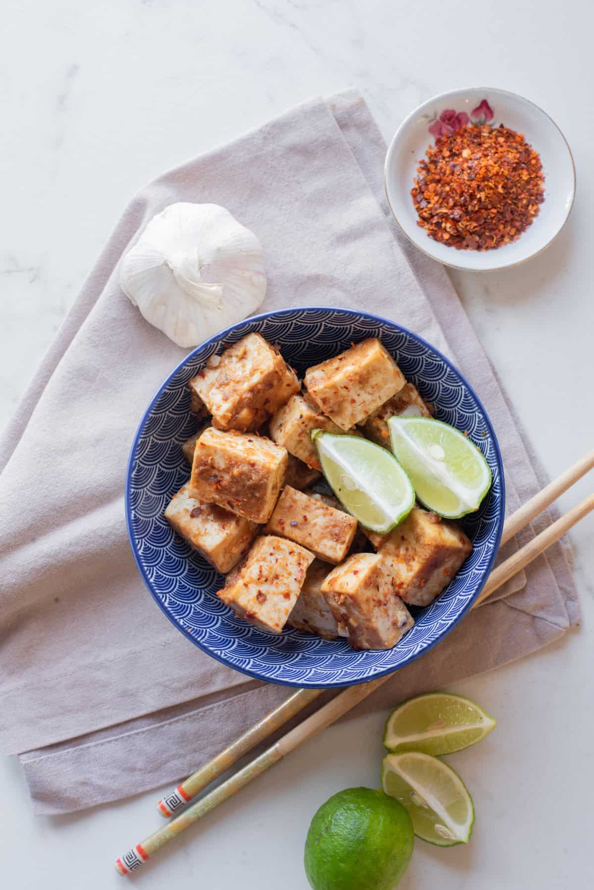 An overhead image of thai peanut tofu served on a plate.