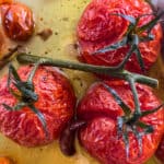 Close up of blistered tomatoes in tomato confit