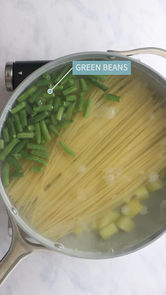 Step 3: Add green beans to pot with potatoes and pasta.