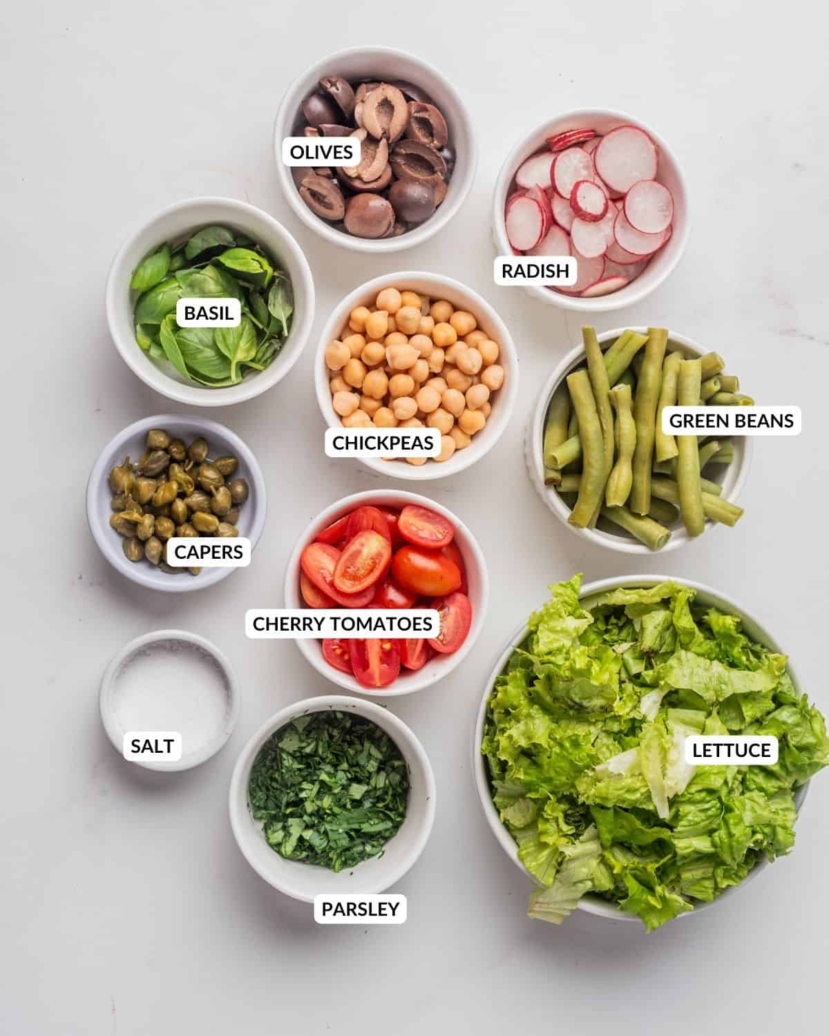 An image of the ingredients of vegan nicoise salad.
