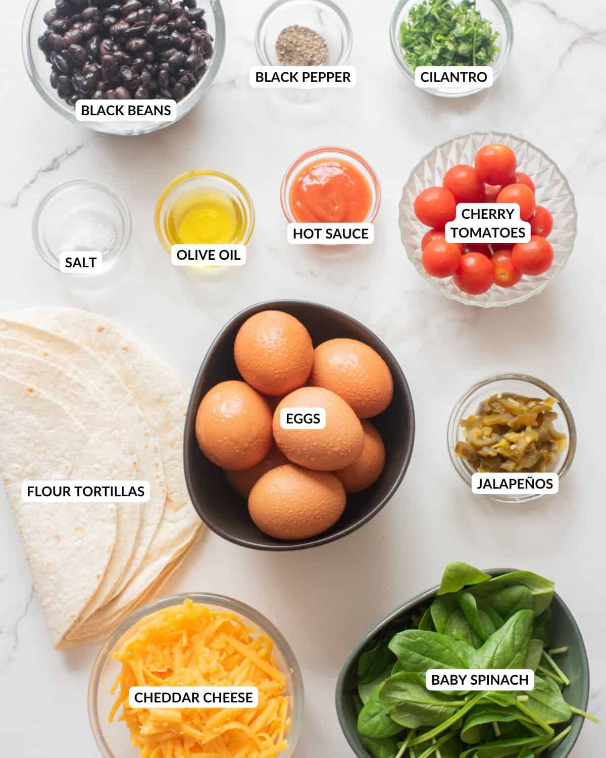 An overhead image of the ingredients of vegetarian breakfast quesadilla.