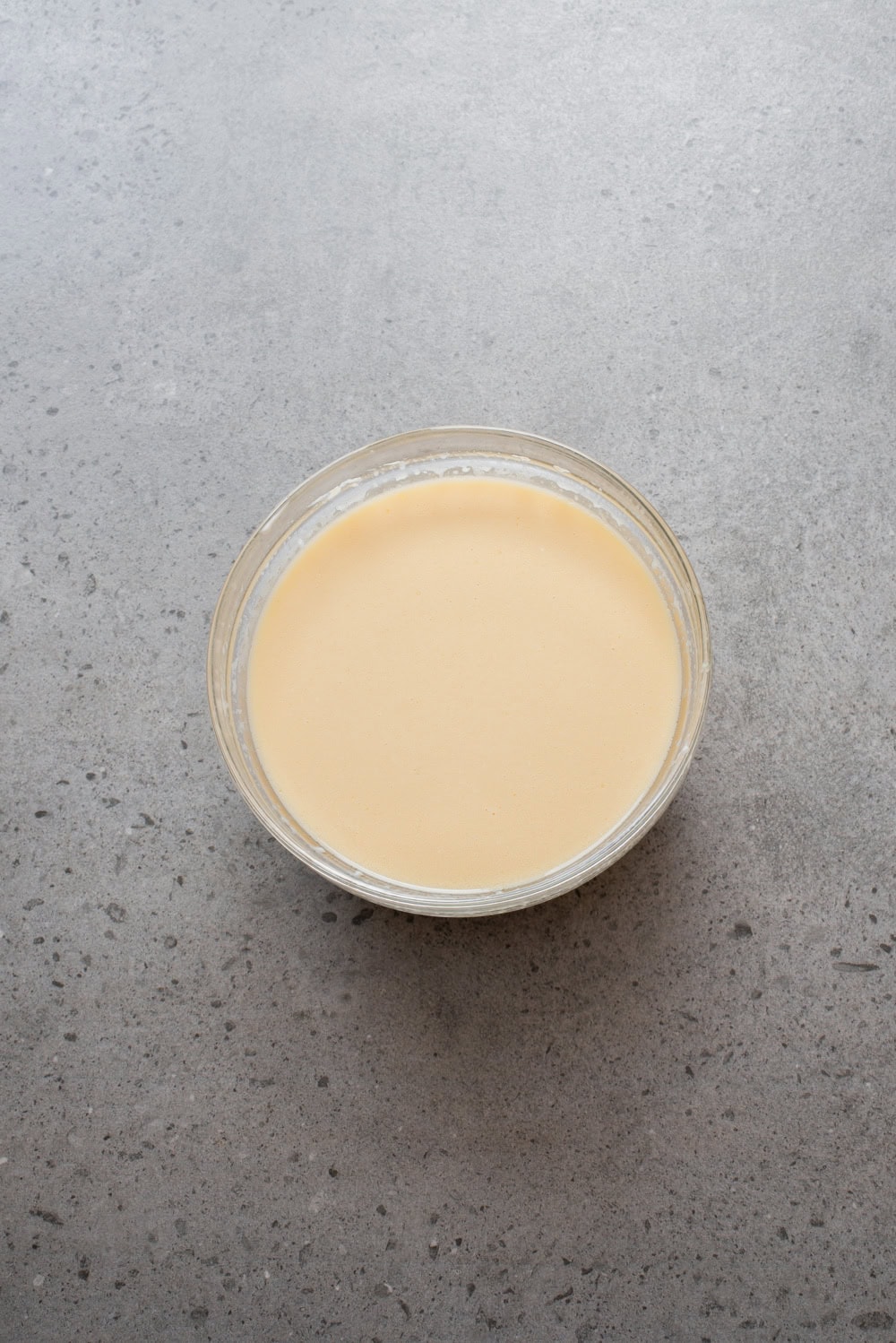 An overhead image of the wet ingredient mixture in a bowl.