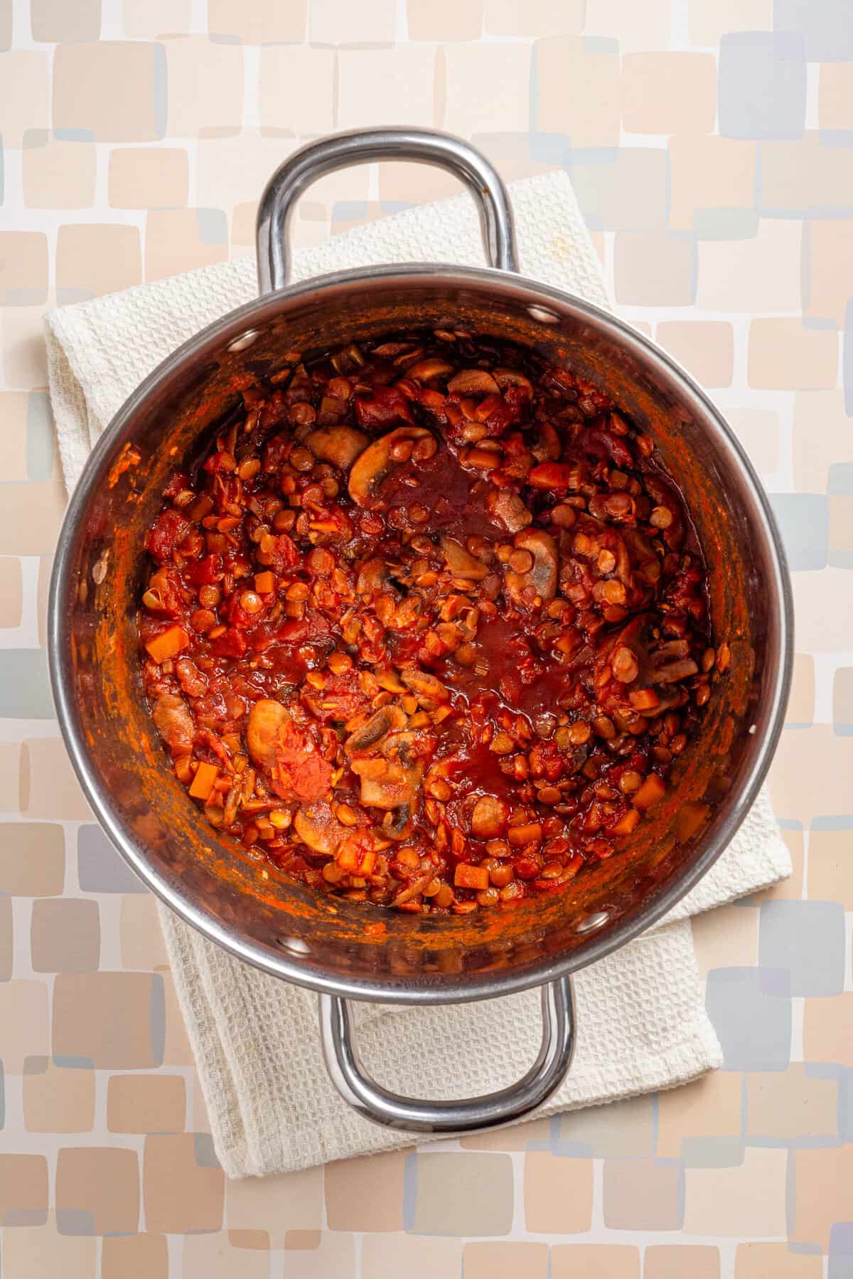 An image of cooked vegan bolognese in a saucepan.