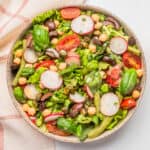 An image of vegan nicoise salad served on a big bowl.